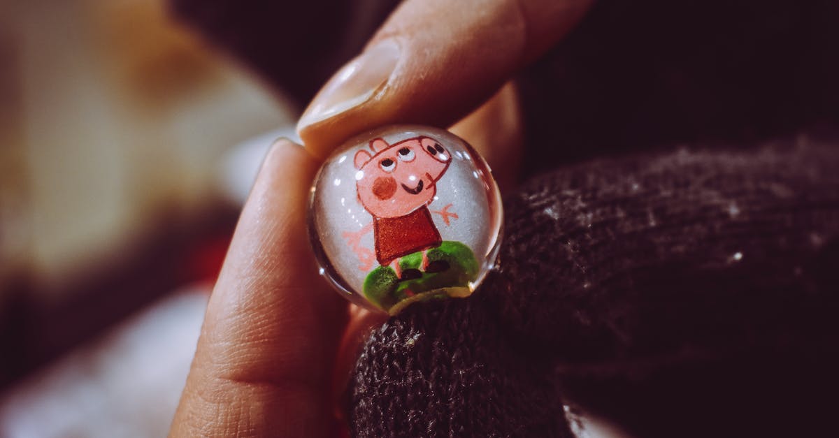Why is Peppa a Pig? - Person Holding Peppa Pig Toy Marble