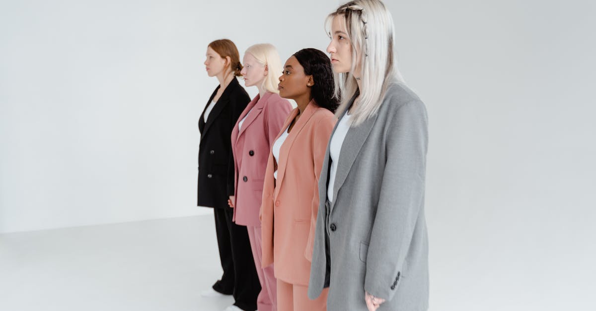 Why is the timeline so different in the episode 2 of “What If...?”? - Woman in Gray Blazer Standing Beside Woman in Pink Blazer