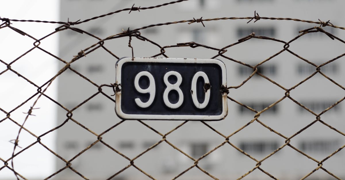 Why is there a safety net conveniently located in the soon-to-be-demolished MI6 building? - 98c Plate on Fence