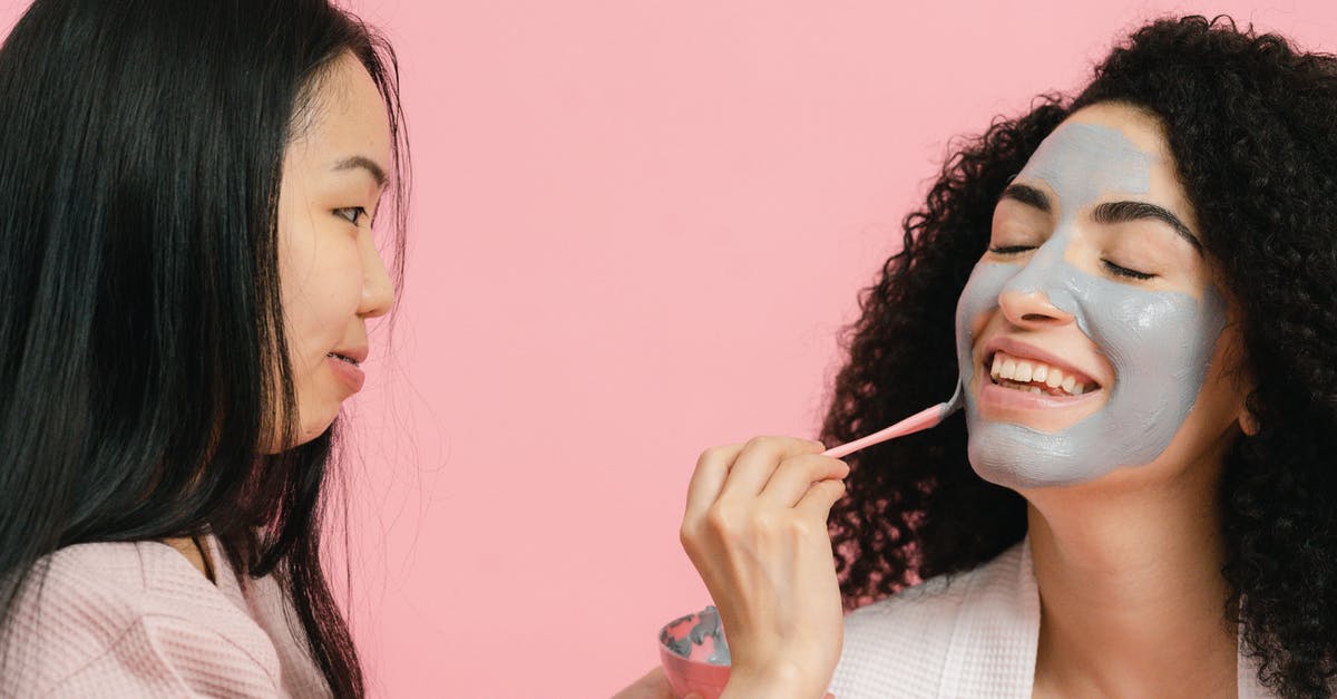 Why is there no sign of facial hair in Pi's face? - Woman putting on cosmetic mask on face of other woman