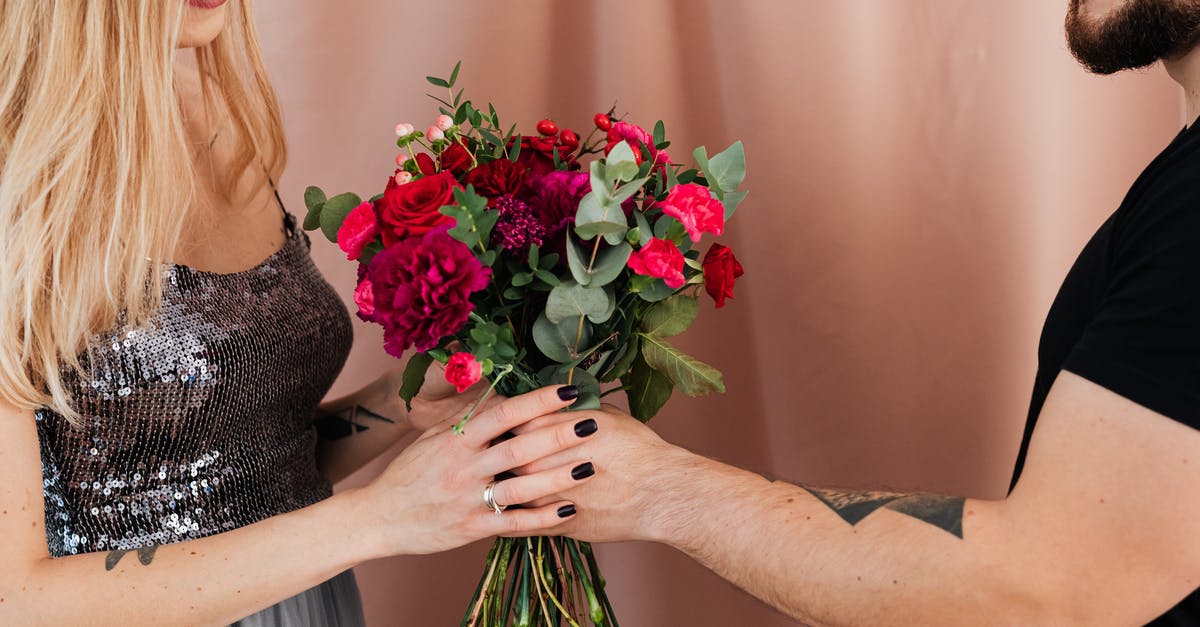 Why is Walt special? - Woman Holding Bouquet of Red Roses