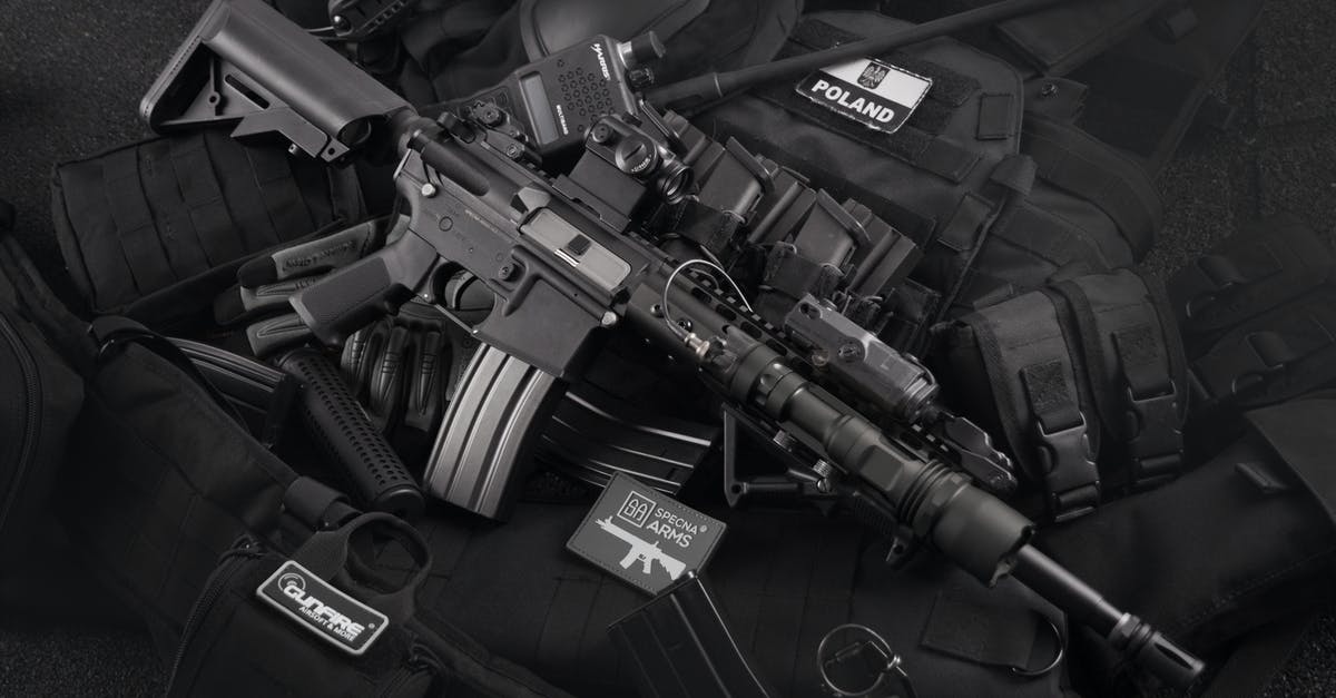 Why look and shake your gun after ammo runs out? - Grayscale Photo of Black M4a1 on Magazines