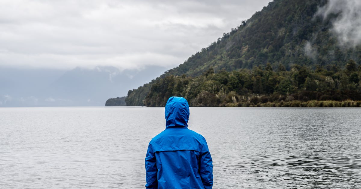Why not travel back in time earlier? - Person Wearing Blue Hoodie Near Body of Water