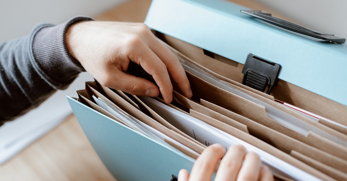 Why the empty briefcase? - Person choosing document in folder