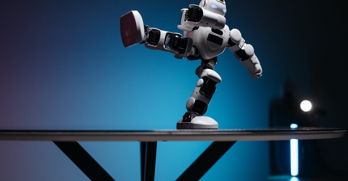 Why the Robots were so unconventional? - A White Robot with Leg Raised Sideways