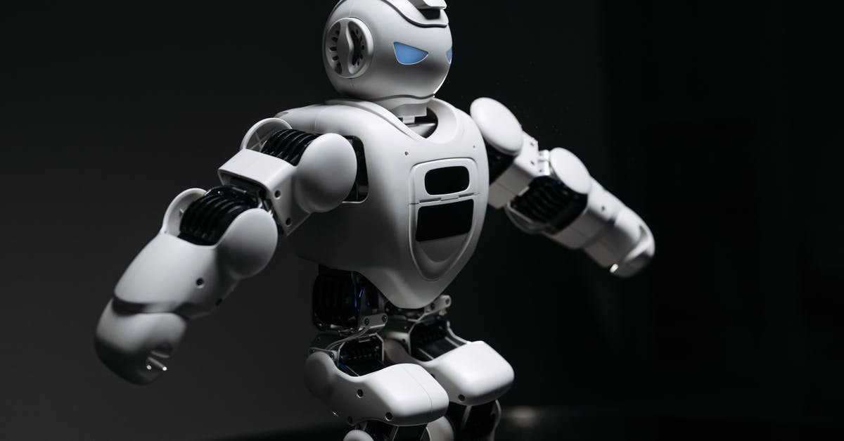Why the Robots were so unconventional? - A White Robot Toy with Knees Bent