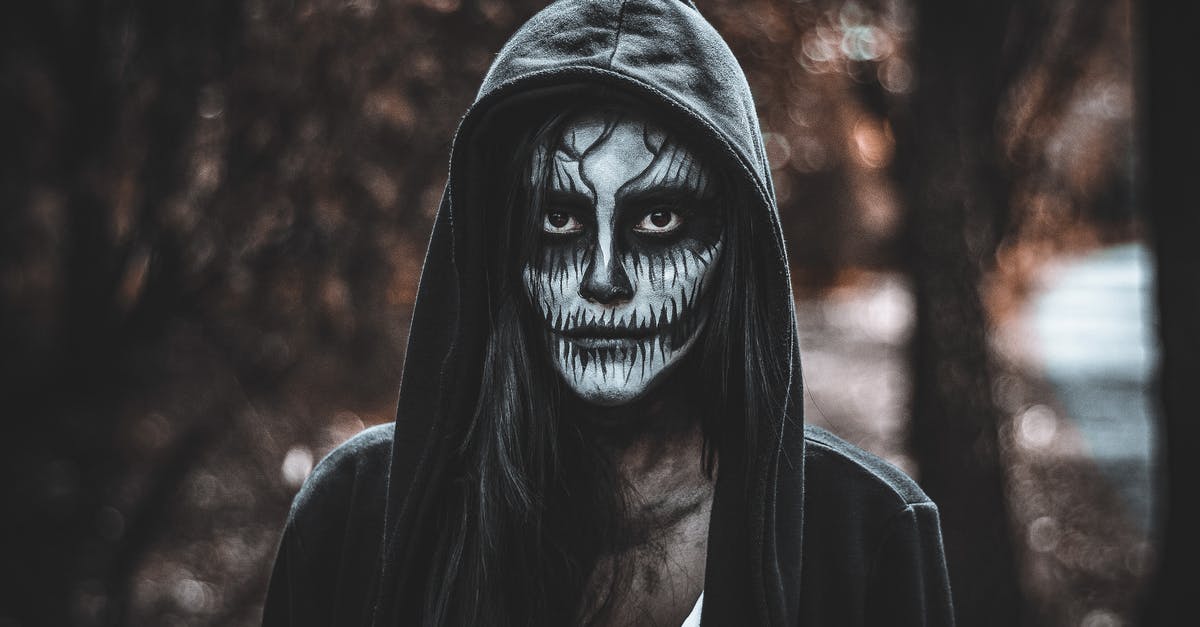 Why was a female selected for M's character in James Bond? - A Woman with Catrina Makeup Wearing a Black Hoodie