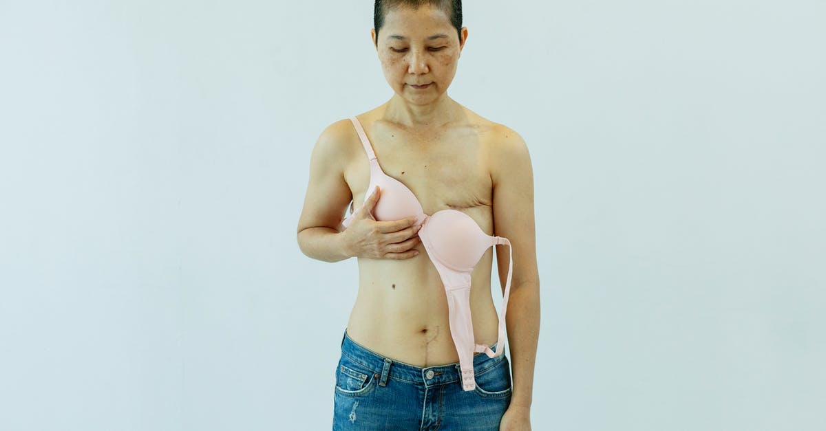 Why was Angel Dust's breast not shown during her fight? - Asian woman in unfastened bra suffering from breast cancer