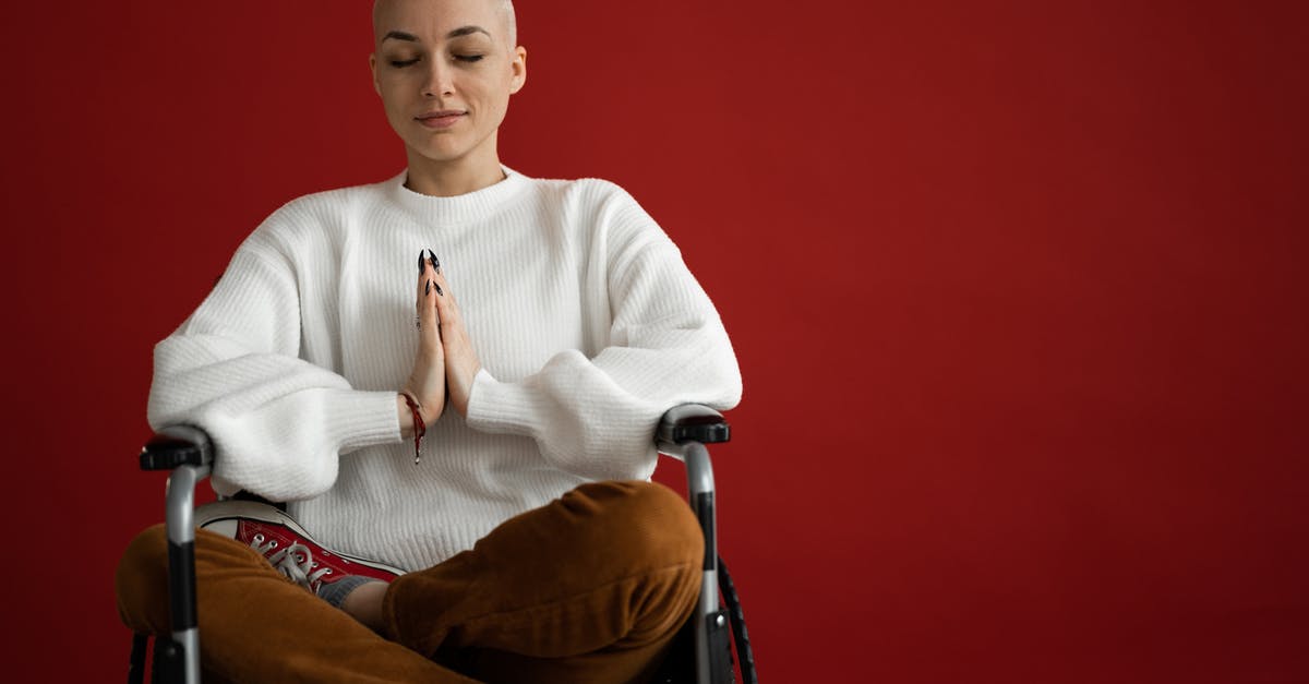 Why was Blofeld in a wheelchair in the beginning of For Your Eyes Only? - Young concentrated female with praying hands and crossed legs meditating during cancer recovery process on red background