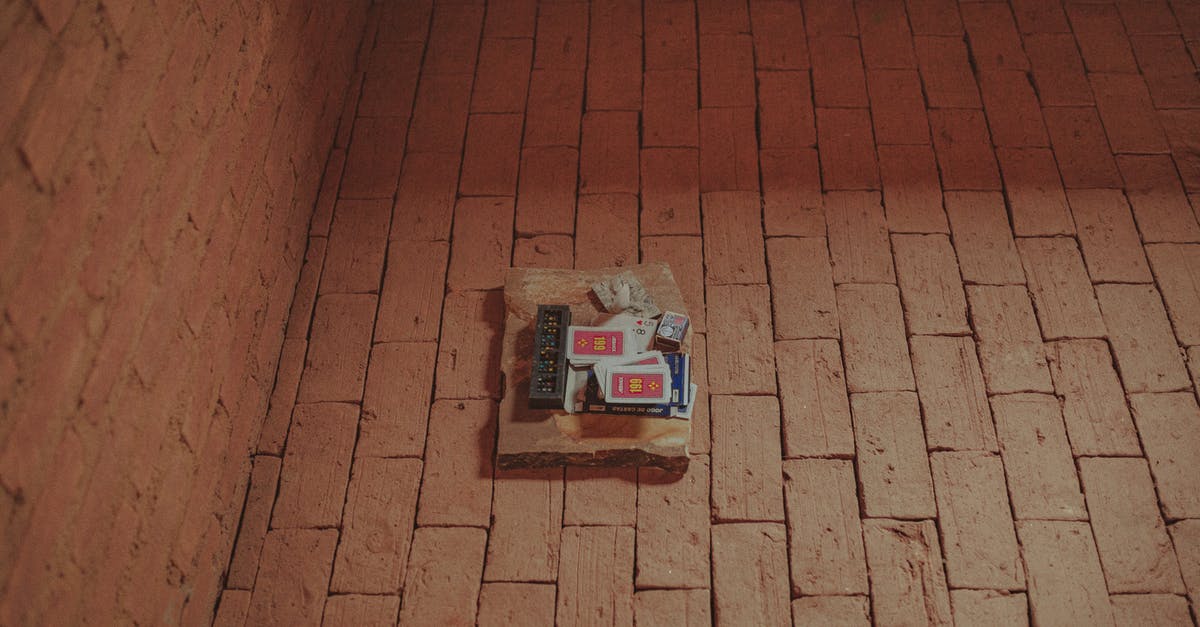 Why was Henry Wilcox released from prison in Covert Affairs? - From above of domino and card decks placed together with matches on brick aged pavement