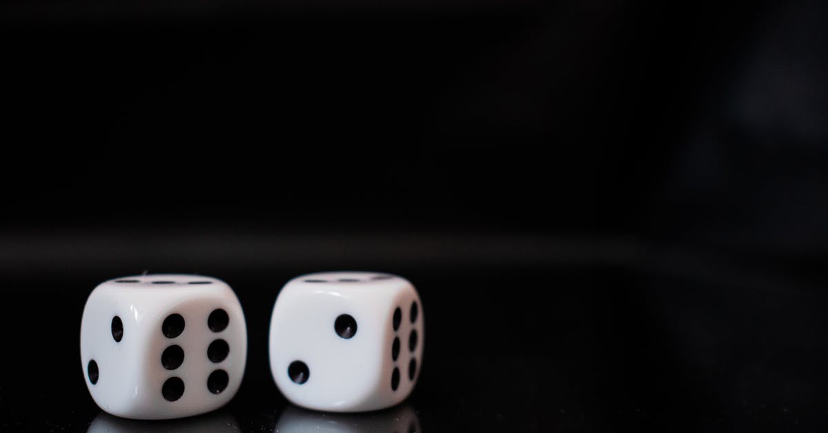 Why was the body needed in Lucky Number Slevin? - Close-up View Of Two White Dices on Black Surface