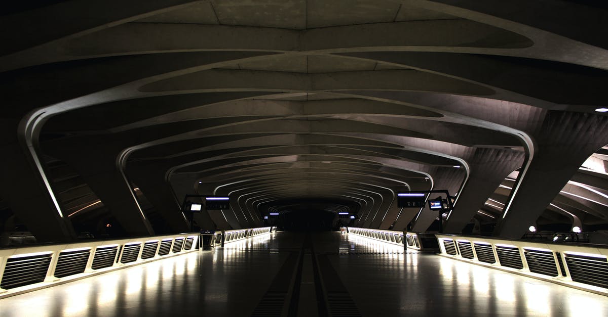 Why was the police station shown to be empty at night? - Perspective view of modern dark empty train station with illuminated sides of walkway and futuristic ceiling in night time inside