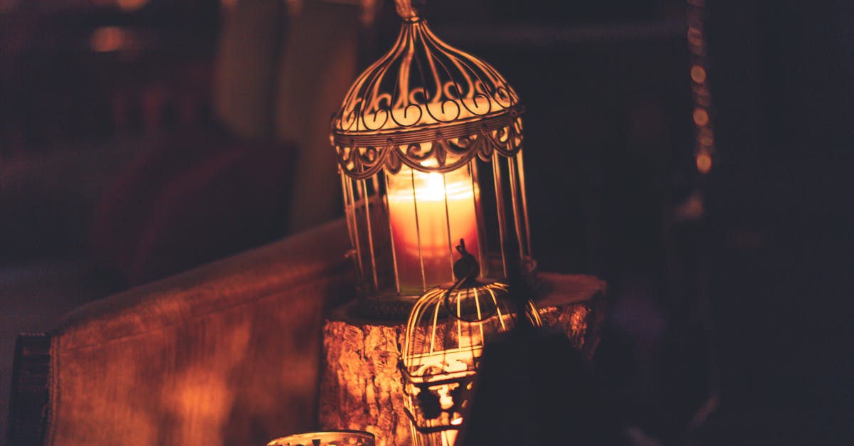 Why was Thor in a cage and how did he get there? - Photo Of Brown Metal Cage With Lighted Candle