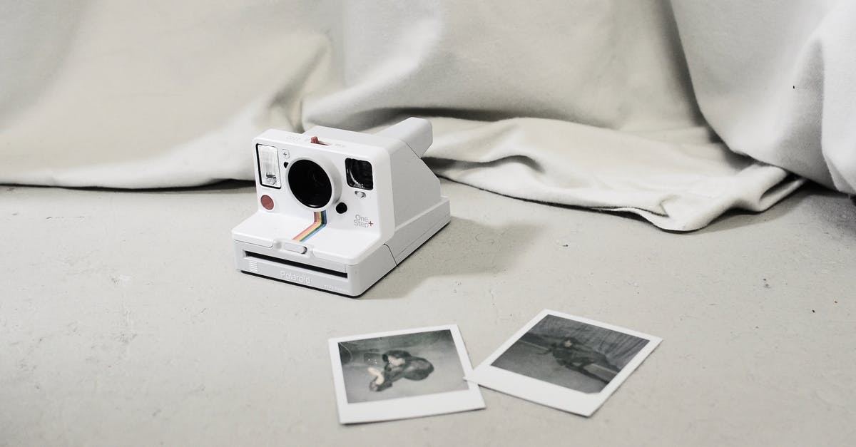 Why were movies shot on film shot at 24 frames per second? - Instant photos placed near modern instant photo camera