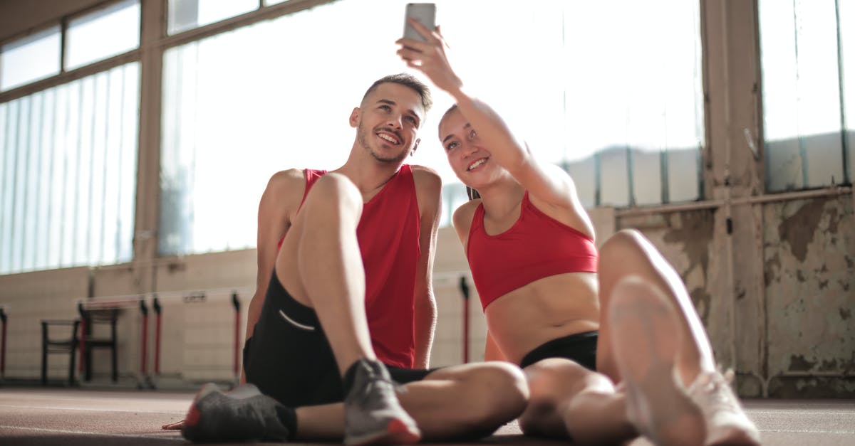 Why were the bodies positioned in this way? -  Woman in   Red Sports Bra and Black Shorts Doing Selfie