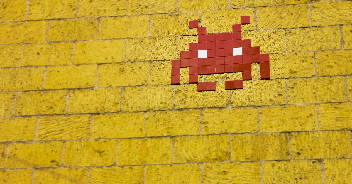 Why were the protagonists the enemies during the Pac-Man game in Pixels? - Mosaic Alien on Wall