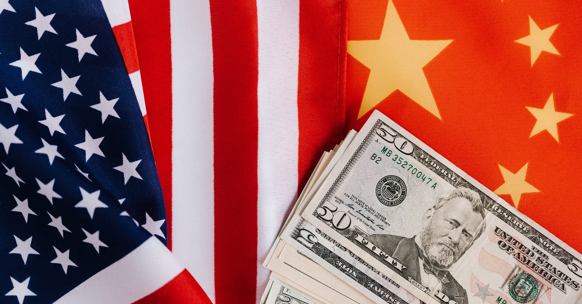 Why were the writers trying to play up the Chinese as more advanced than the United States? - American and Chinese flags and USA dollars