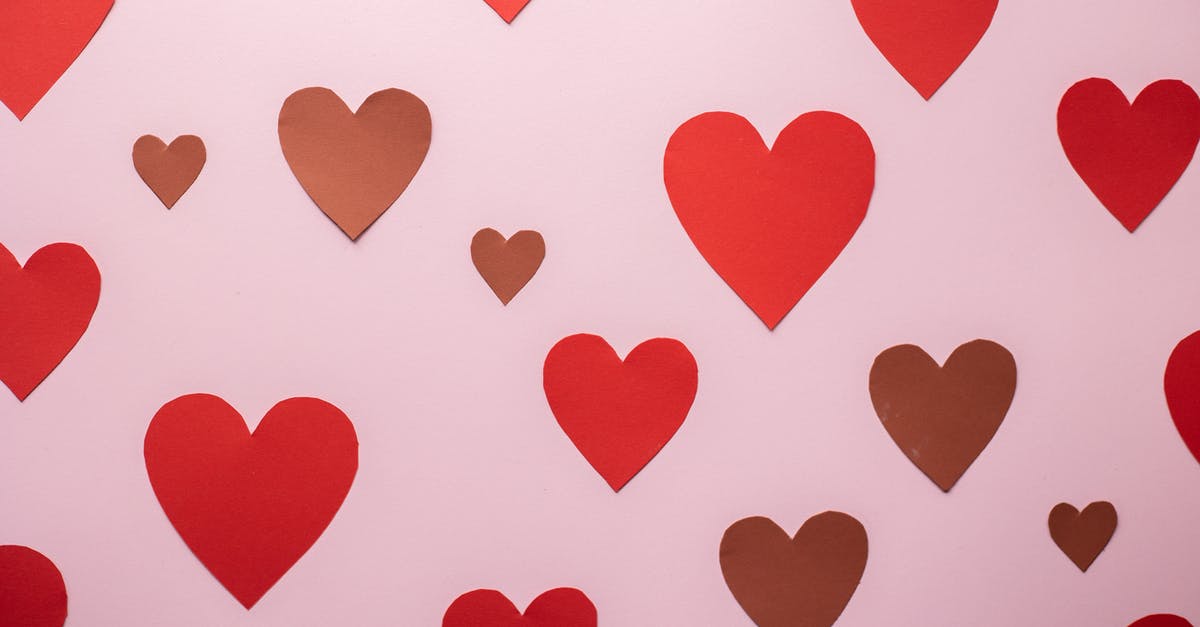 Why were two songs cut in the 2001 musical Roméo et Juliette: de la Haine à l'Amour? - Cutout paper heart stickers glued on pink background symbolizing romantic Valentines Day celebration