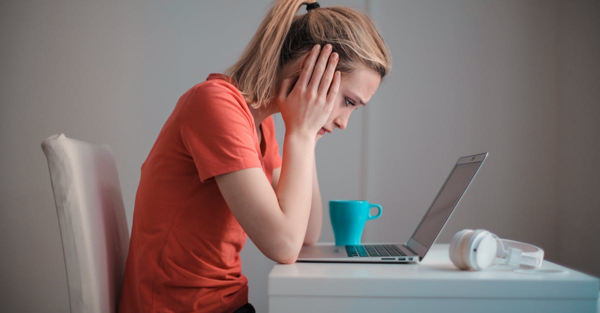 Why would someone think that taking formerly catatonic patients to a museum cause a problem for them? - Young troubled woman using laptop at home