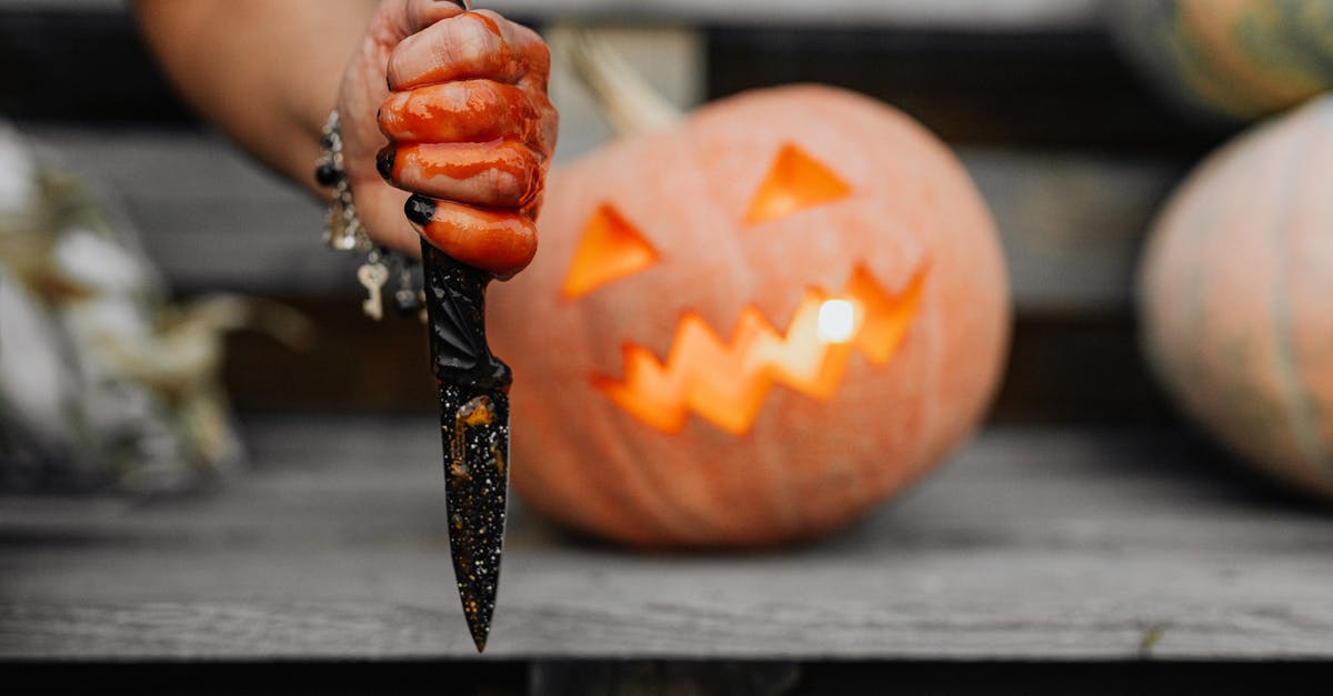 Women's Blood Siphoned Out to Feed Invading Aliens [closed] - Person Holding Jack O Lantern