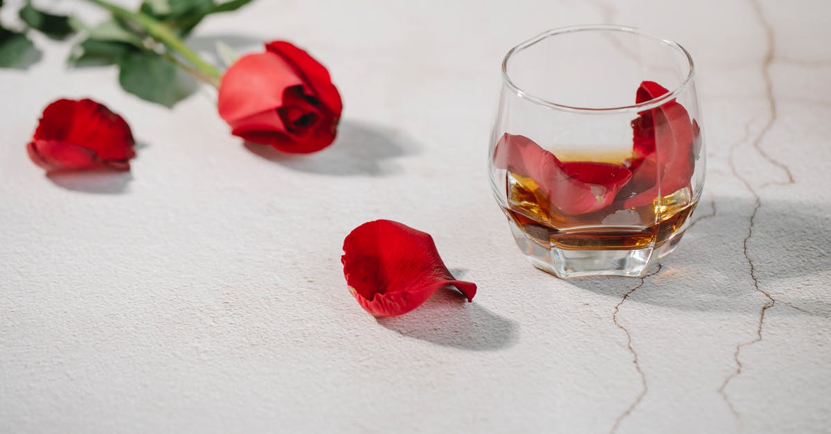 Wouldn't both glasses of brandy have "tasted a bit shit"? - Red rose petals in glass of cognac